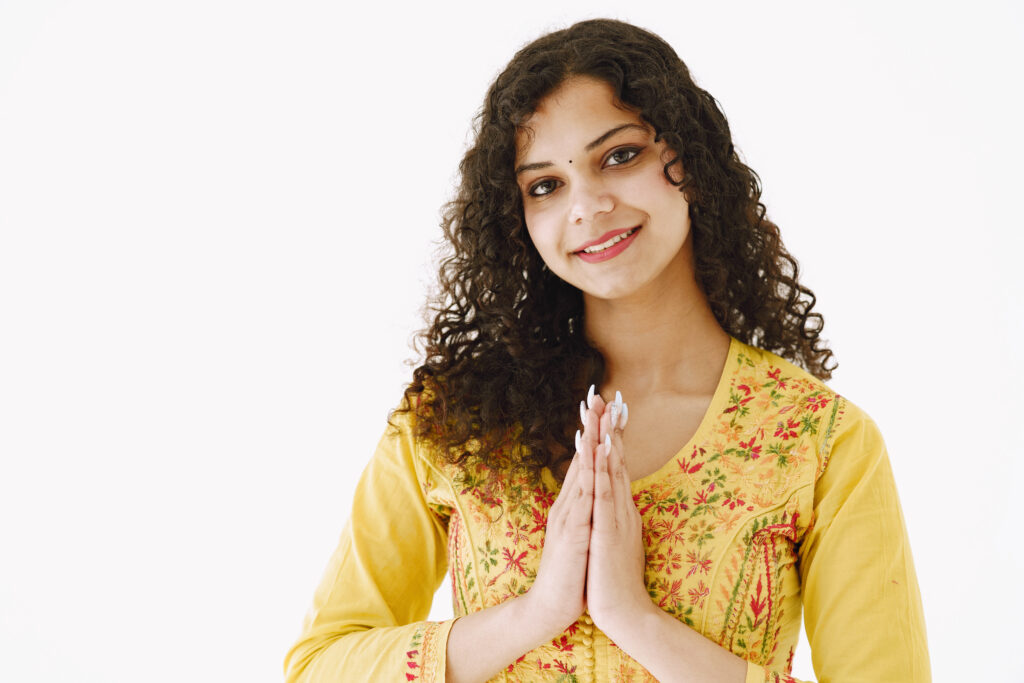 Beautiful portrait of young woman against white background